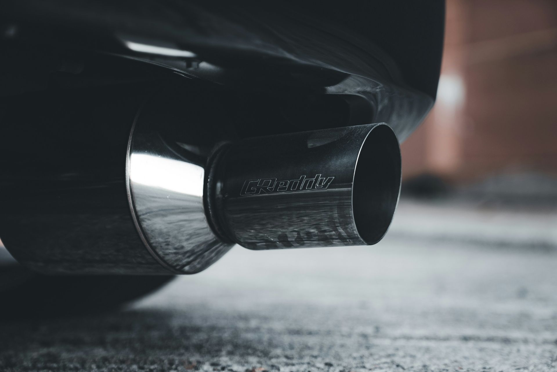 A close up of a car's exhaust pipe